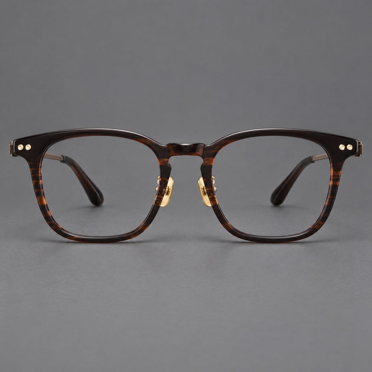 Montatura rétro in acetato e titanio con linee quadrate morbide e cerniere circolari — immagine del prodotto