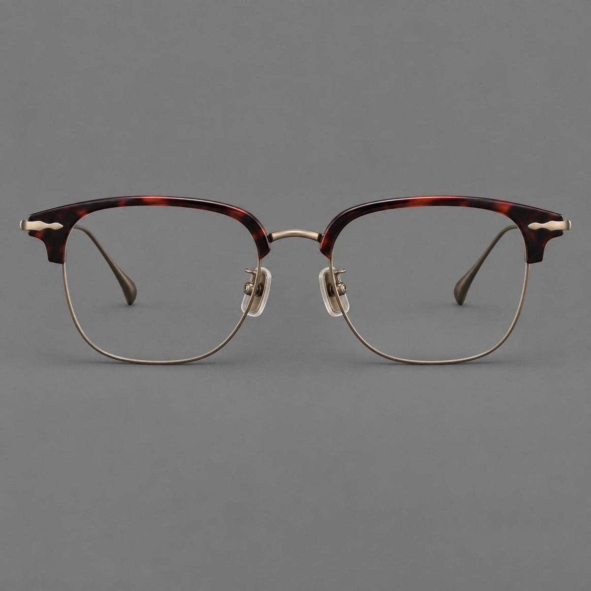Montatura browline in acetato e titanio con bordi inferiori sottili e angoli decorati — immagine del prodotto