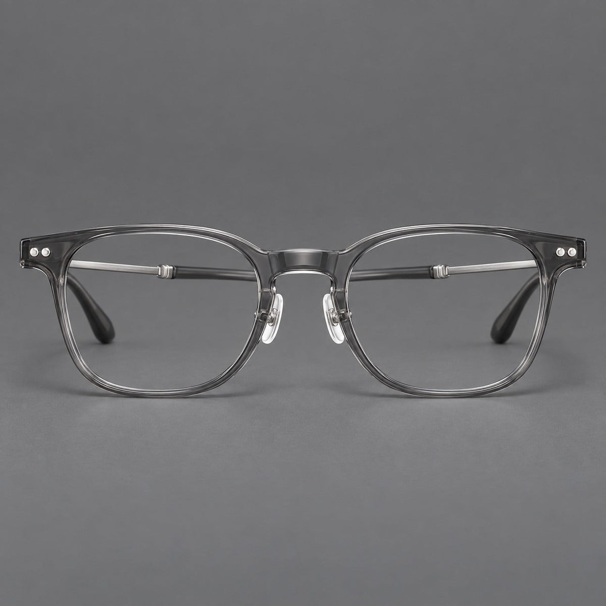 Montatura vintage in acetato e titanio con linee quadrate morbide e rivetti doppi — immagine del prodotto