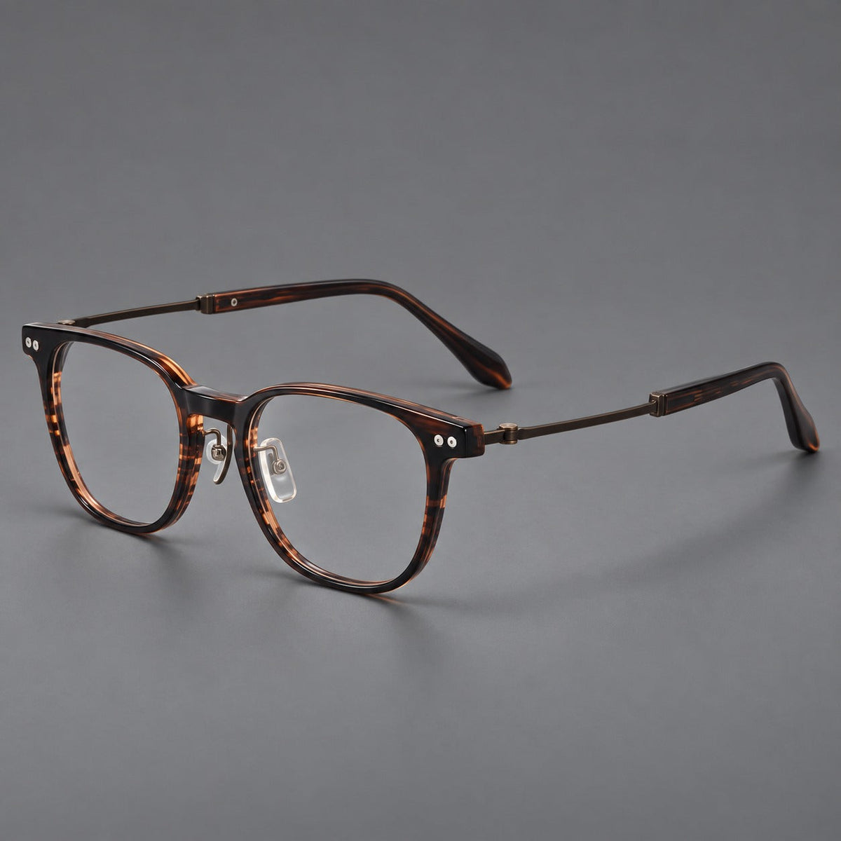 Montatura vintage in acetato e titanio con linee quadrate morbide e rivetti doppi — immagine del prodotto