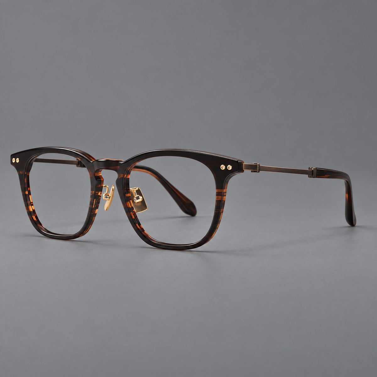 Montatura rétro in acetato e titanio con linee quadrate morbide e cerniere circolari — immagine del prodotto