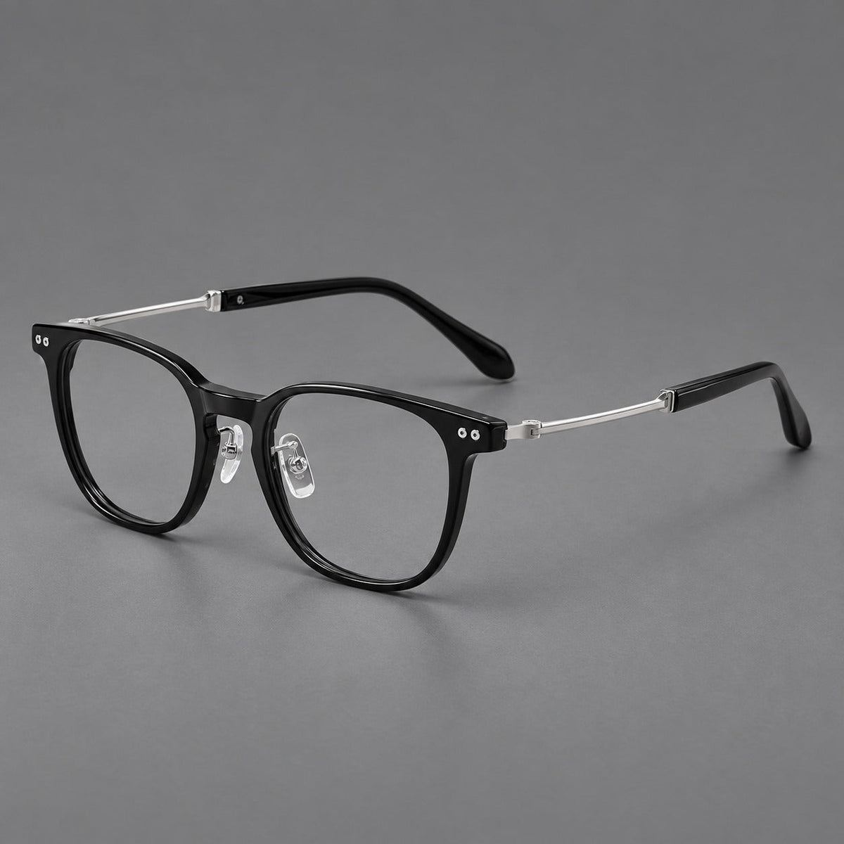 Montatura vintage in acetato e titanio con linee quadrate morbide e rivetti doppi — immagine del prodotto