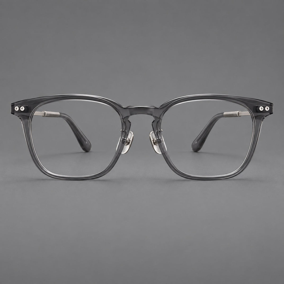 Montatura rétro in acetato e titanio con linee quadrate morbide e cerniere circolari — immagine del prodotto