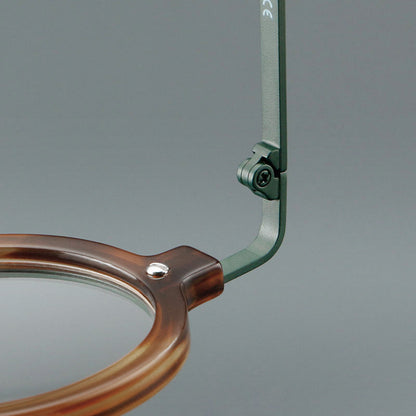 Montatura rotonda artigianale in acetato con cerchi a strati e ponte sagomato — dettaglio 20