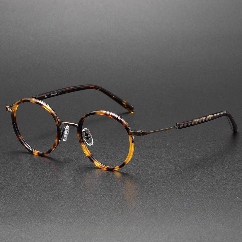 Montatura rotonda vintage in titanio con ponte in metallo, disponibile in più modelli — dettaglio 17