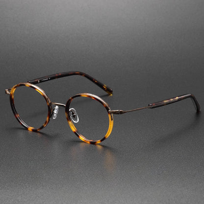 Montatura rotonda vintage in titanio con ponte in metallo, disponibile in più modelli — dettaglio 17