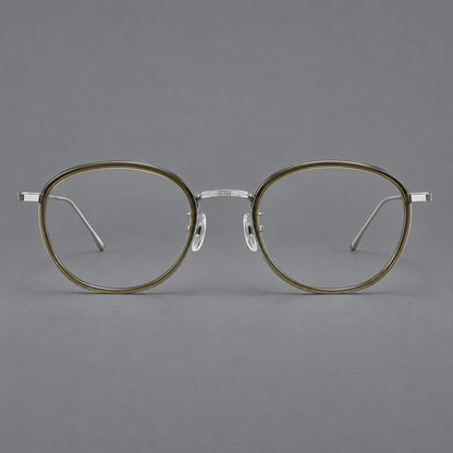 Montatura rotonda vintage in acetato e titanio con ponte inciso e aste sottili — immagine del prodotto