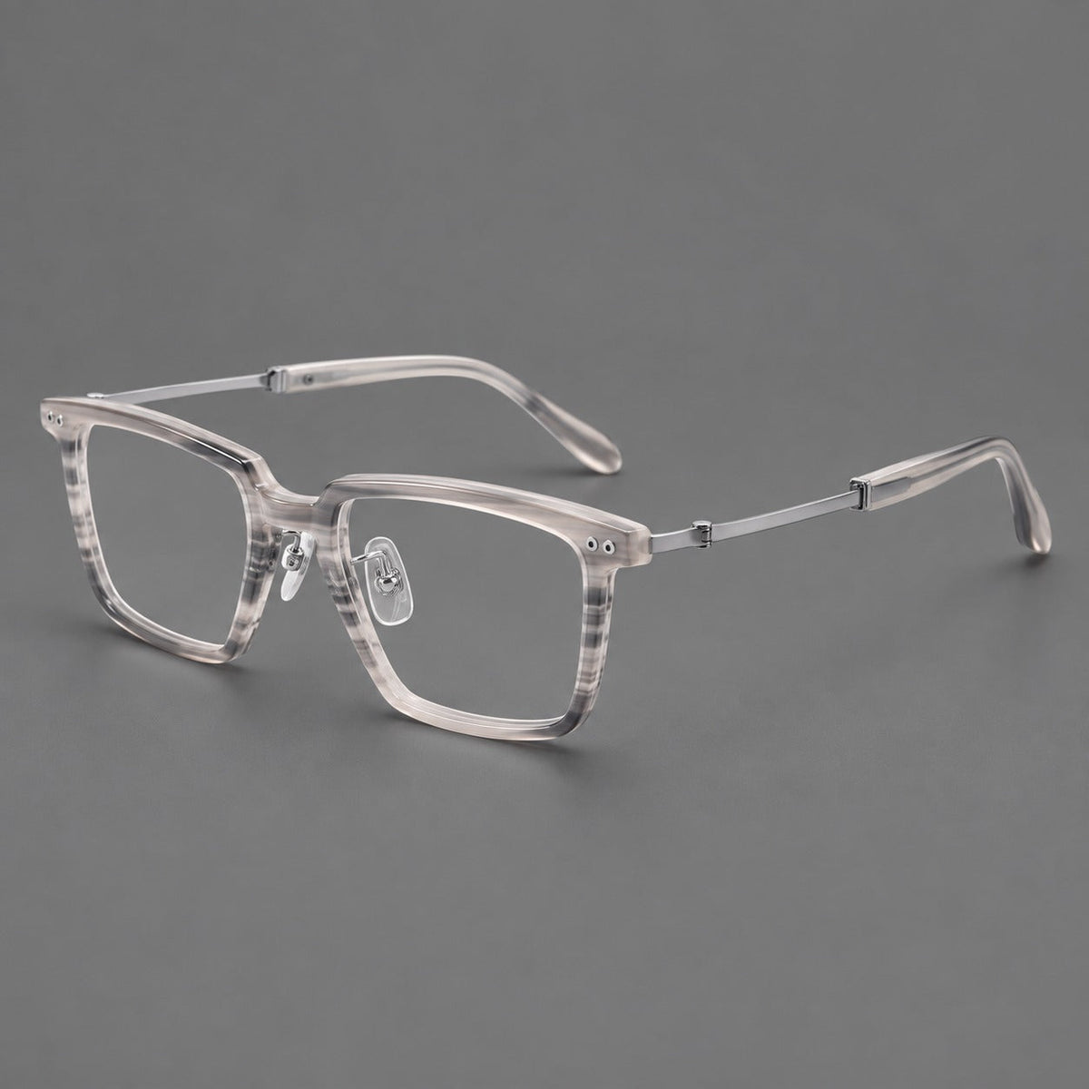 Montatura classica in acetato e titanio con bordo diritto e forme rettangolari arrotondate — immagine del prodotto