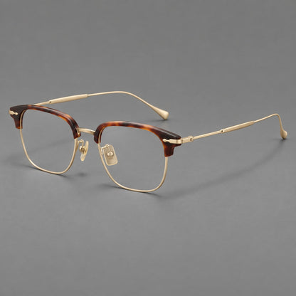 Montatura browline in acetato e titanio con bordi inferiori sottili e angoli decorati — immagine del prodotto