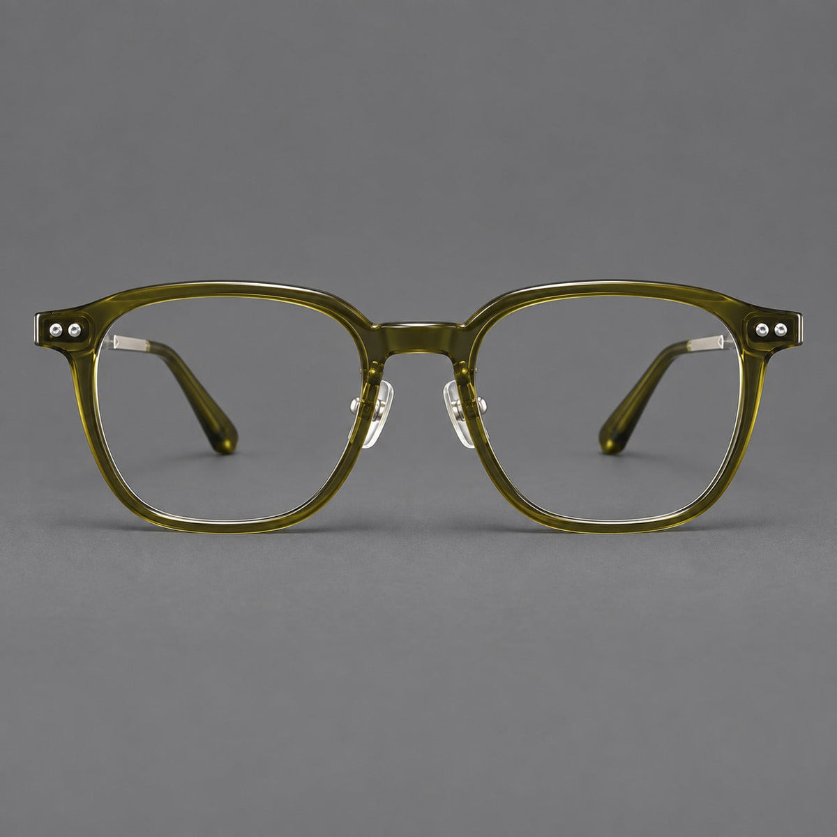 Montatura vintage in acetato e titanio con bordi quadrati arrotondati e aste traforate — immagine del prodotto
