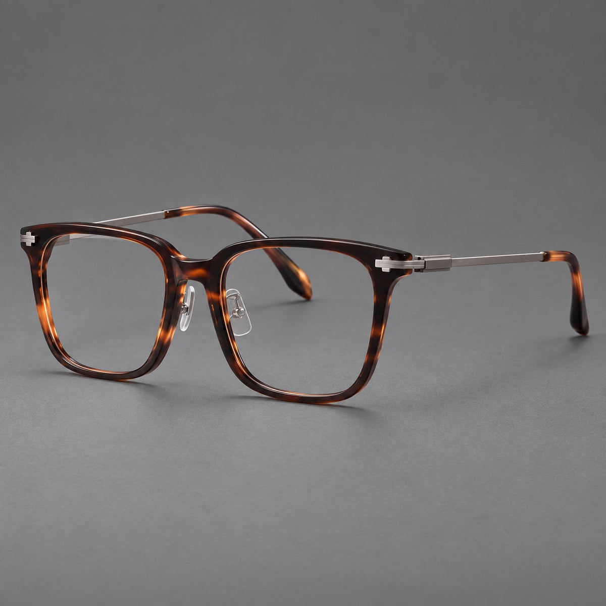 Montatura classica in acetato e titanio con bordi quadrati ampi e aste lavorate — immagine del prodotto