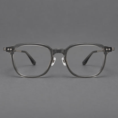 Montatura vintage in acetato e titanio con bordi quadrati arrotondati e aste traforate — immagine del prodotto