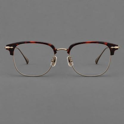 Montatura browline in acetato e titanio con bordi inferiori sottili e angoli decorati — immagine del prodotto