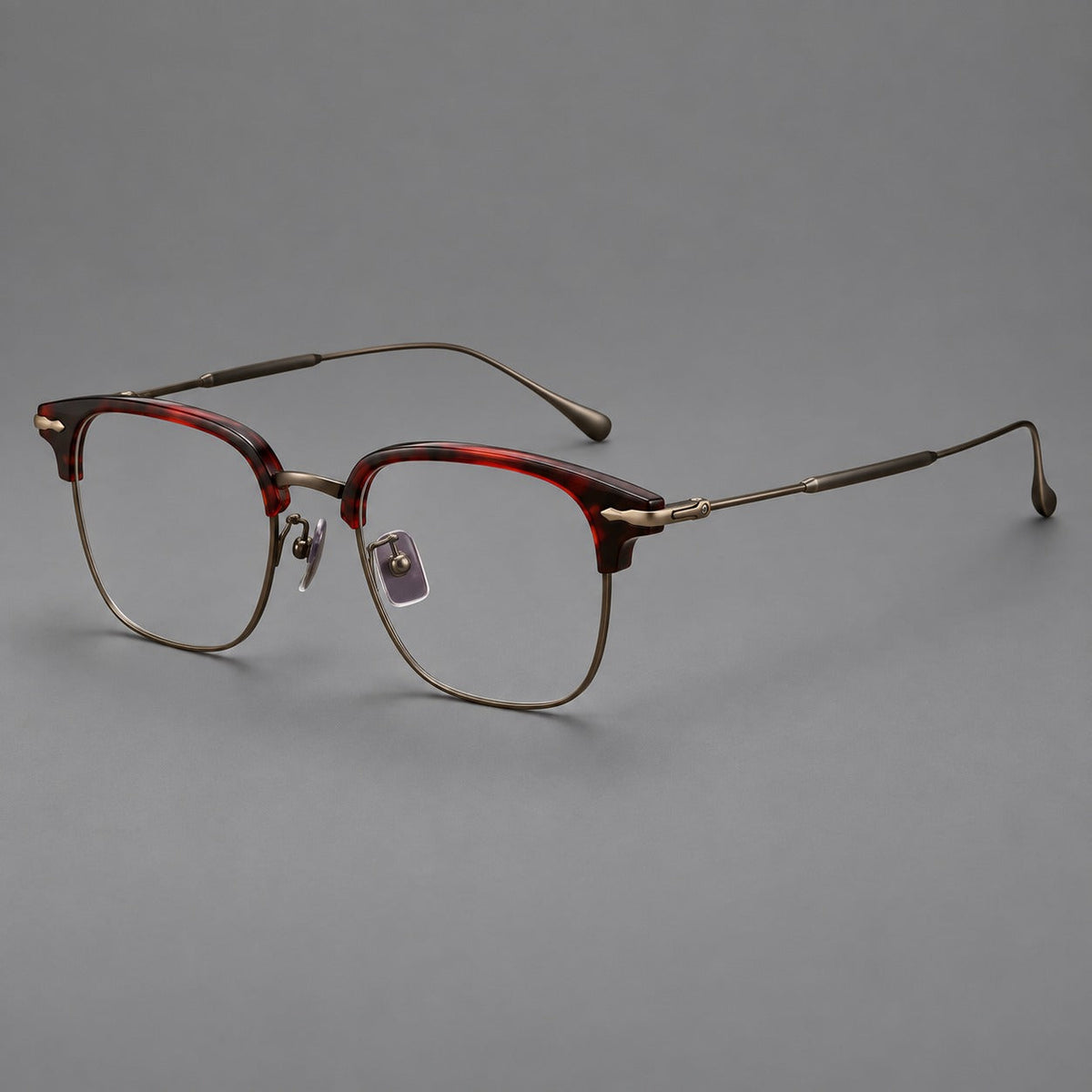 Montatura browline in acetato e titanio con bordi inferiori sottili e angoli decorati — immagine del prodotto