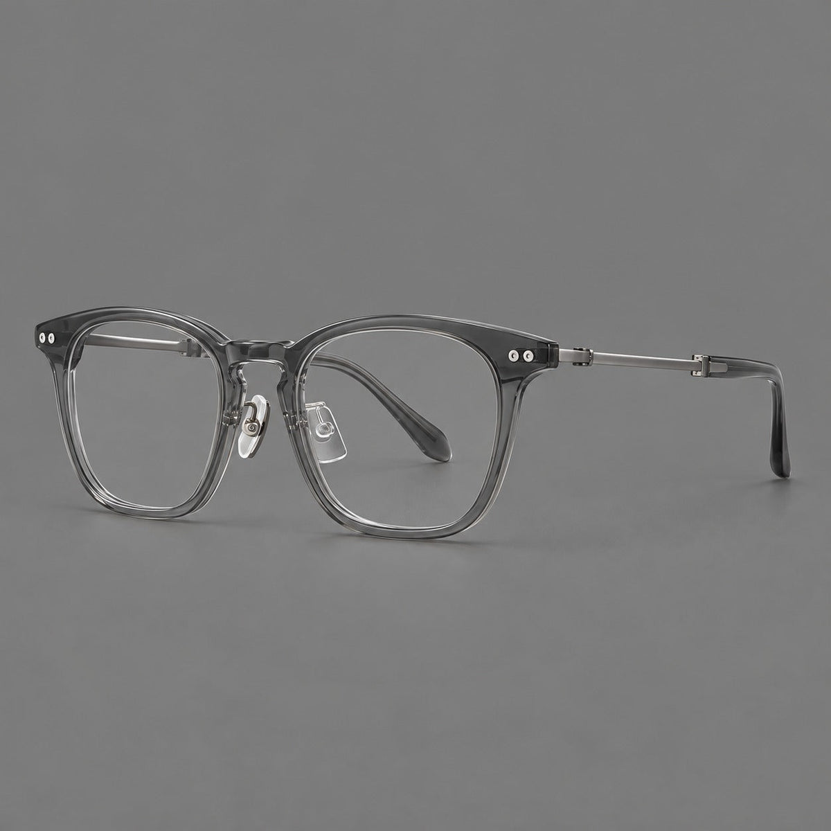 Montatura rétro in acetato e titanio con linee quadrate morbide e cerniere circolari — immagine del prodotto