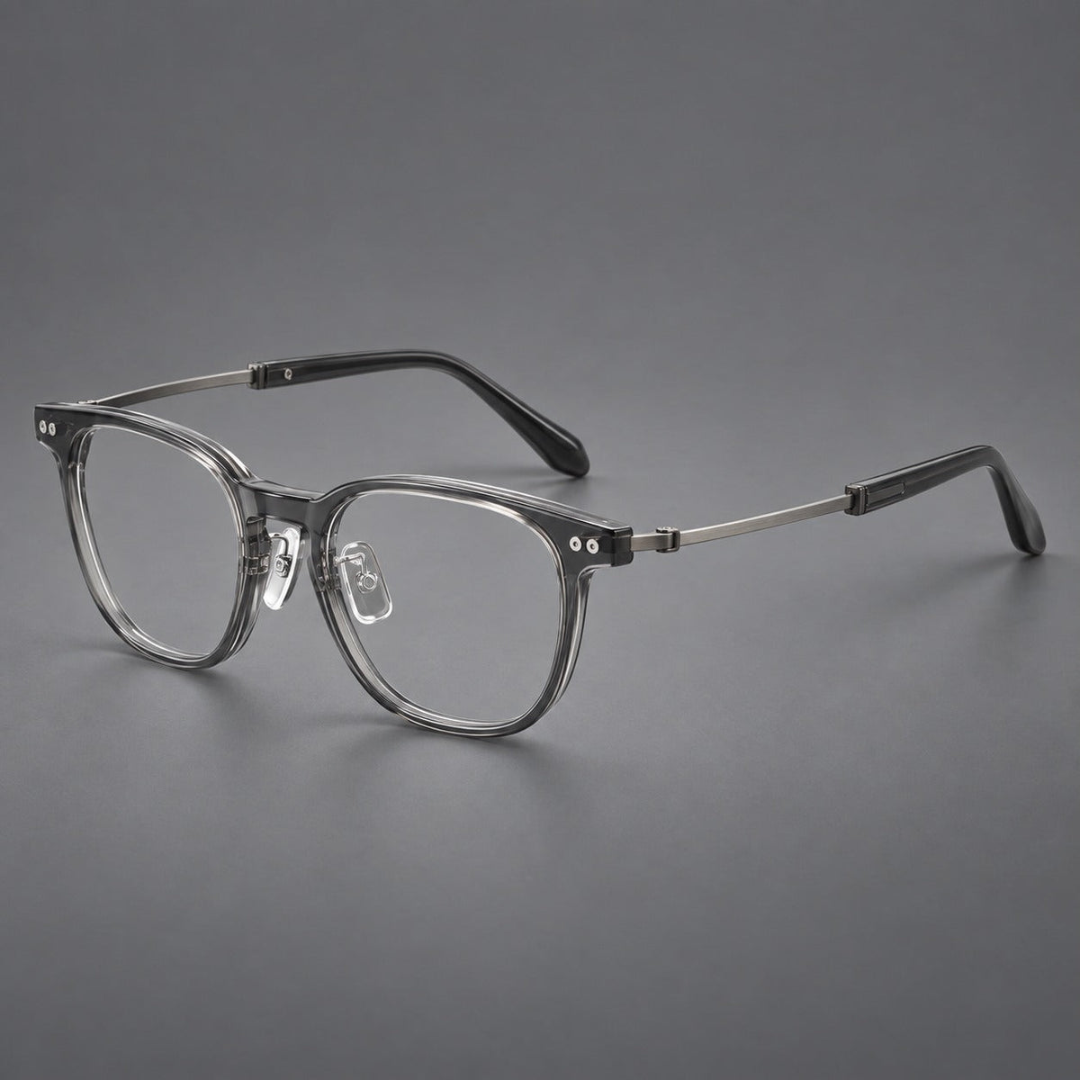Montatura vintage in acetato e titanio con linee quadrate morbide e rivetti doppi — immagine del prodotto
