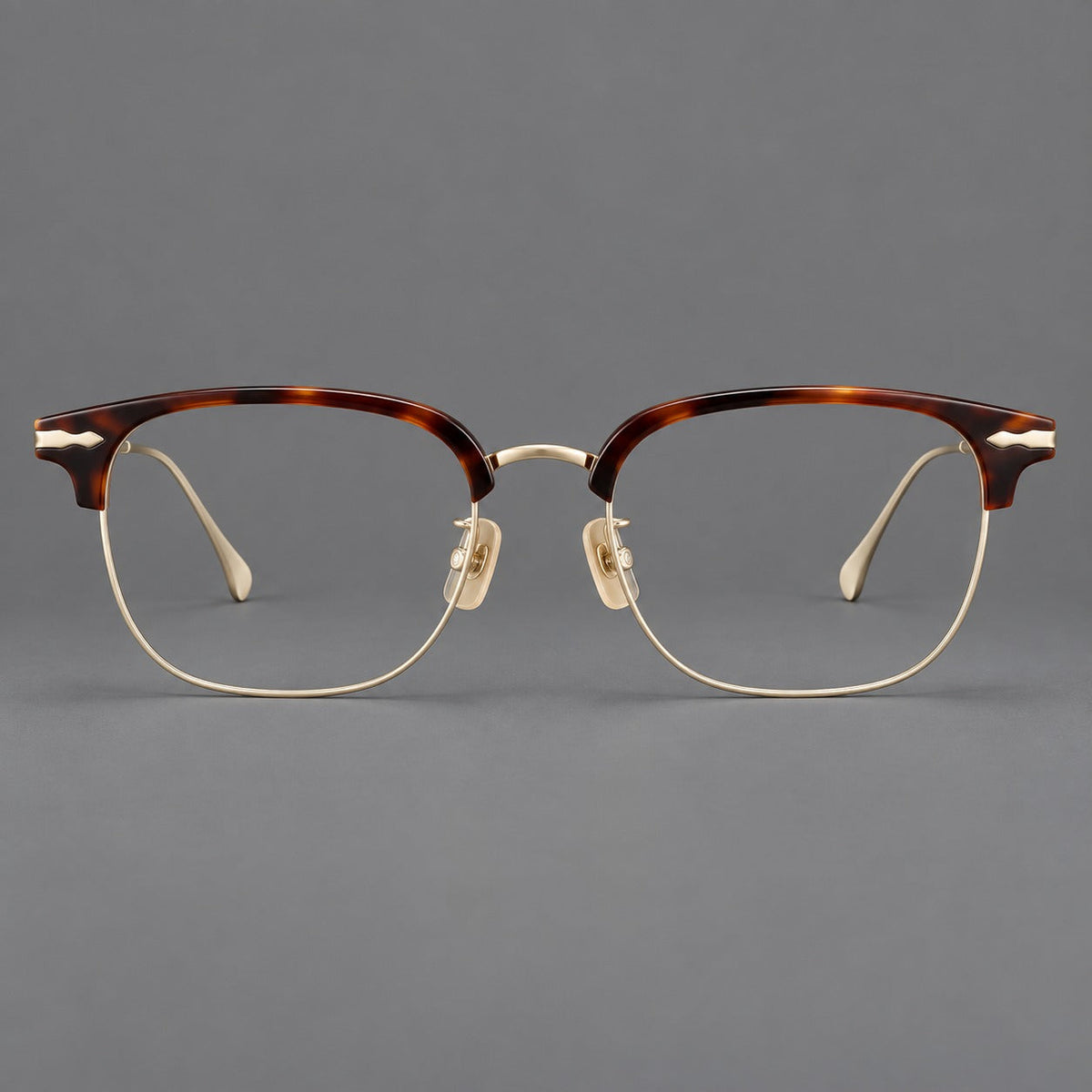 Montatura browline in acetato e titanio con bordi inferiori sottili e angoli decorati — immagine del prodotto