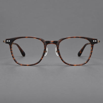 Montatura vintage in acetato e titanio con linee quadrate morbide e rivetti doppi — immagine del prodotto