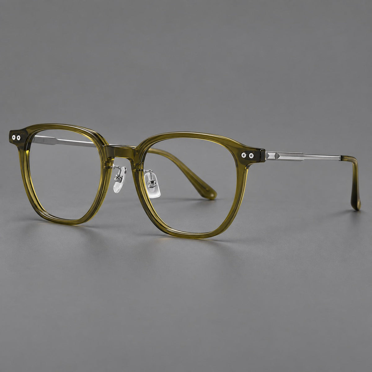Montatura vintage in acetato e titanio con bordi quadrati arrotondati e aste traforate — immagine del prodotto